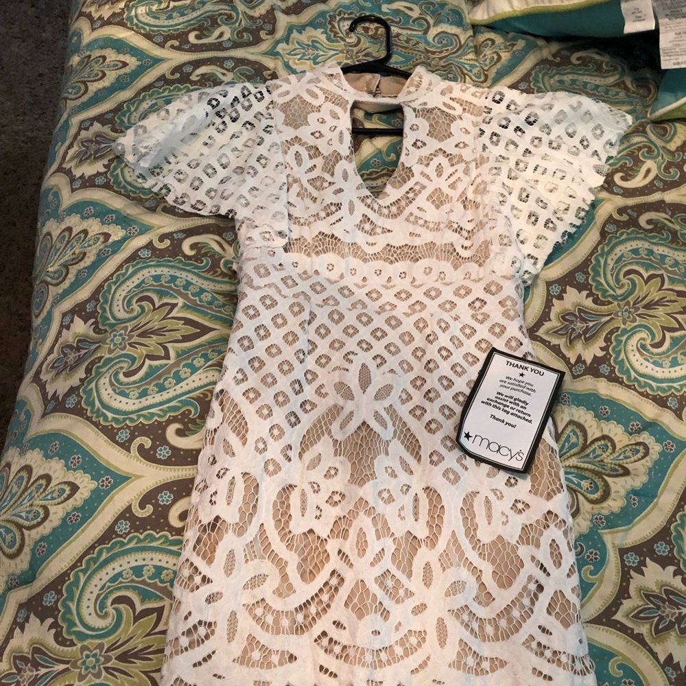 A cream and white lace dress